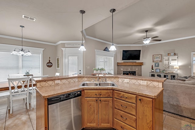 kitchen with light tile patterned floors, visible vents, open floor plan, stainless steel dishwasher, and a sink