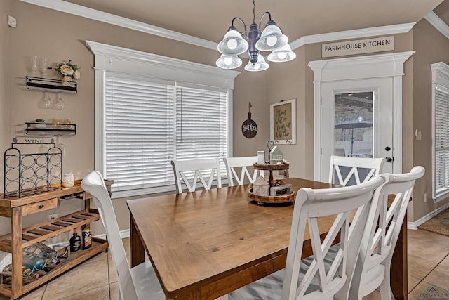 dining space with light tile patterned floors, a notable chandelier, baseboards, and crown molding