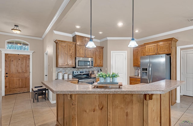 kitchen with light tile patterned floors, stainless steel appliances, a kitchen island, light countertops, and backsplash