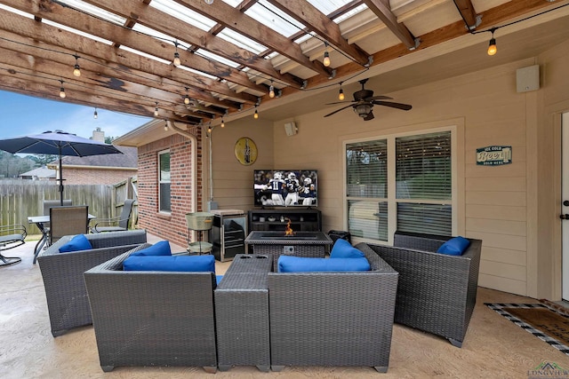 view of patio featuring a ceiling fan, an outdoor hangout area, fence, a pergola, and outdoor dining space