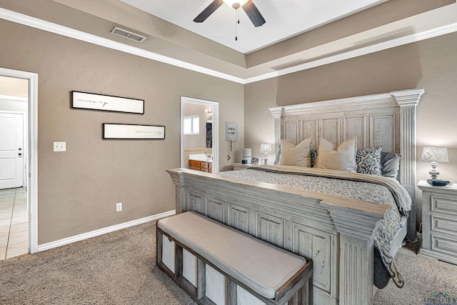 bedroom with baseboards, visible vents, a raised ceiling, crown molding, and carpet floors