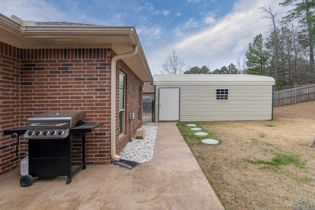 exterior space featuring a grill, an outdoor structure, and fence