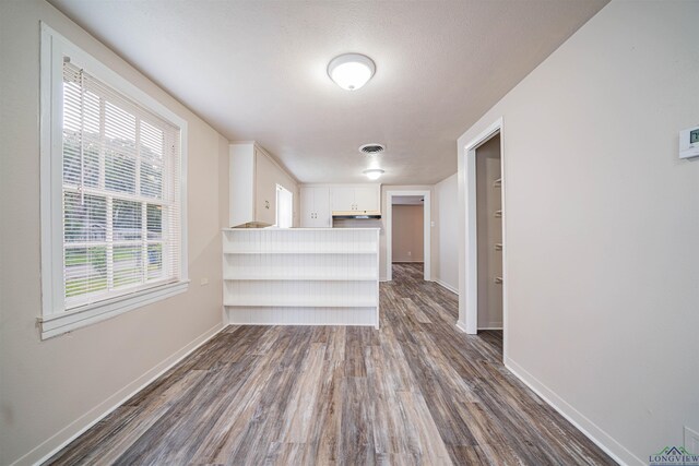 206 Empire St, Gladewater, TX 75647 - bar area with dark wood-style floors and baseboards