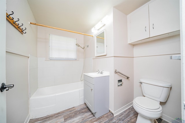 206 Empire St, Gladewater, TX 75647 - full bathroom featuring wood finished floors, vanity, and tub / shower combination