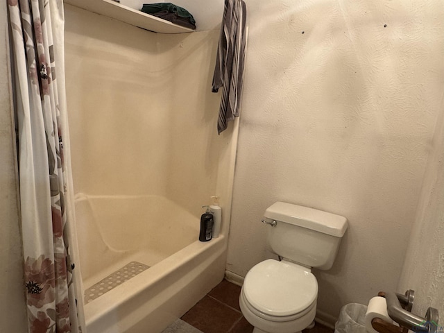 bathroom featuring tile patterned flooring and toilet