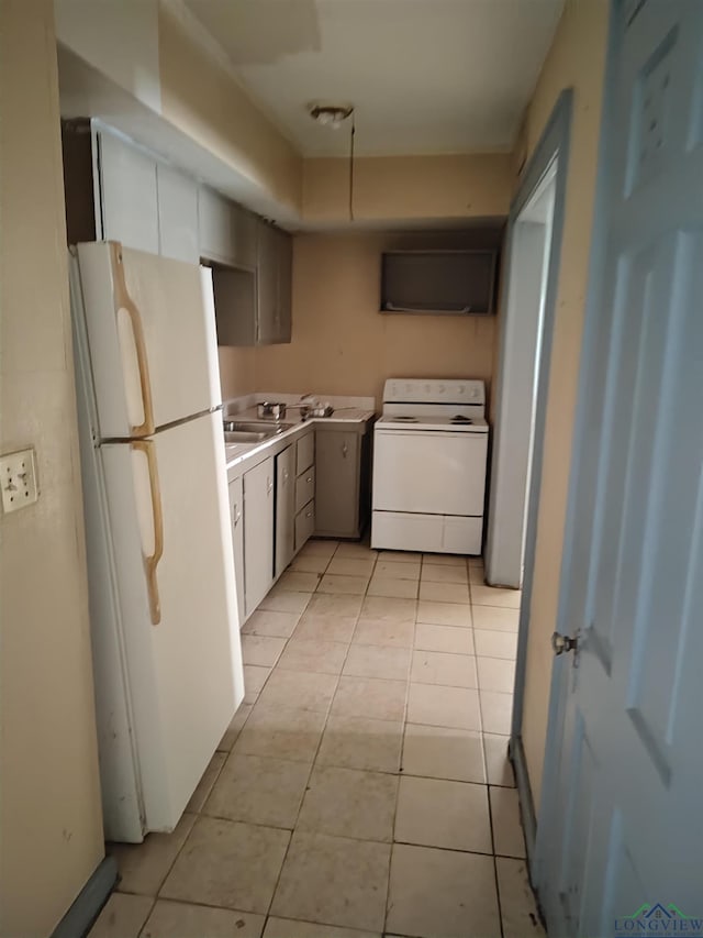 kitchen featuring white appliances and light tile patterned floors