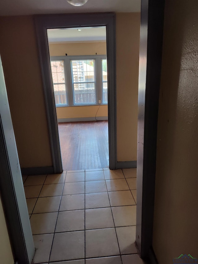 hallway featuring light tile patterned flooring