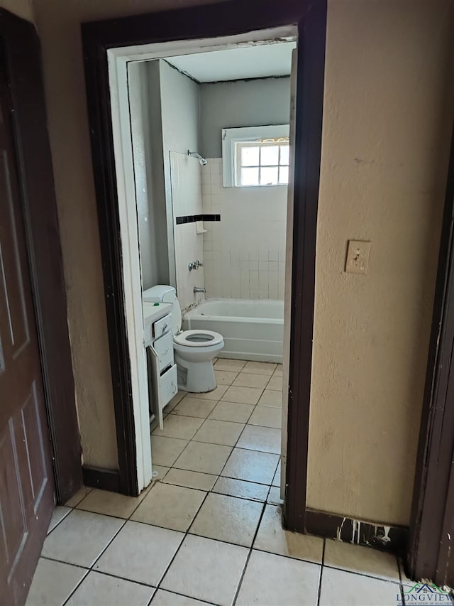 full bathroom featuring tile patterned flooring, vanity, toilet, and tiled shower / bath