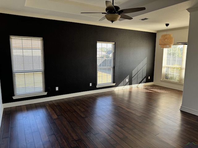 unfurnished room featuring ceiling fan, dark hardwood / wood-style flooring, and ornamental molding