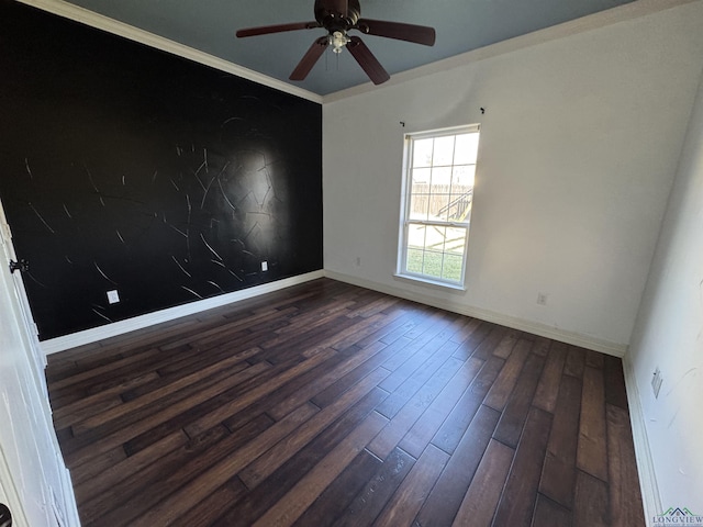 unfurnished room featuring dark hardwood / wood-style floors, ceiling fan, and ornamental molding