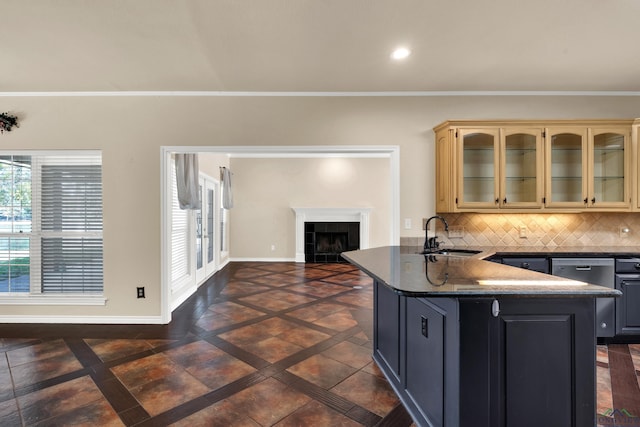 kitchen with backsplash, a tile fireplace, sink, stainless steel dishwasher, and dark tile patterned floors