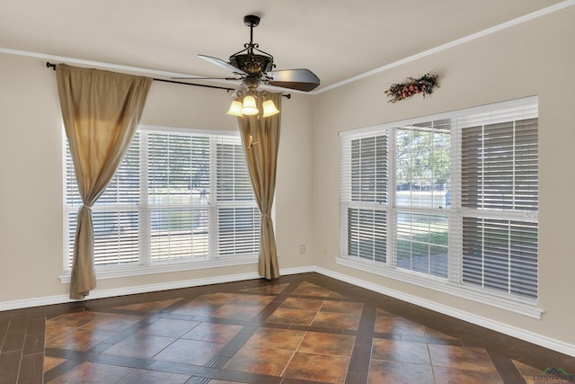 tiled empty room featuring ceiling fan and ornamental molding