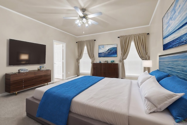 carpeted bedroom with multiple windows, ceiling fan, and crown molding