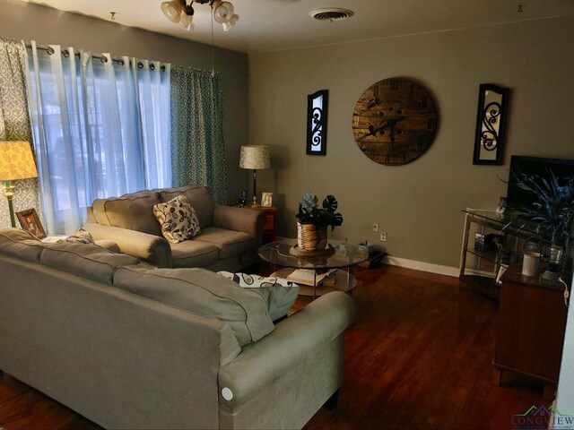 living room with dark hardwood / wood-style floors