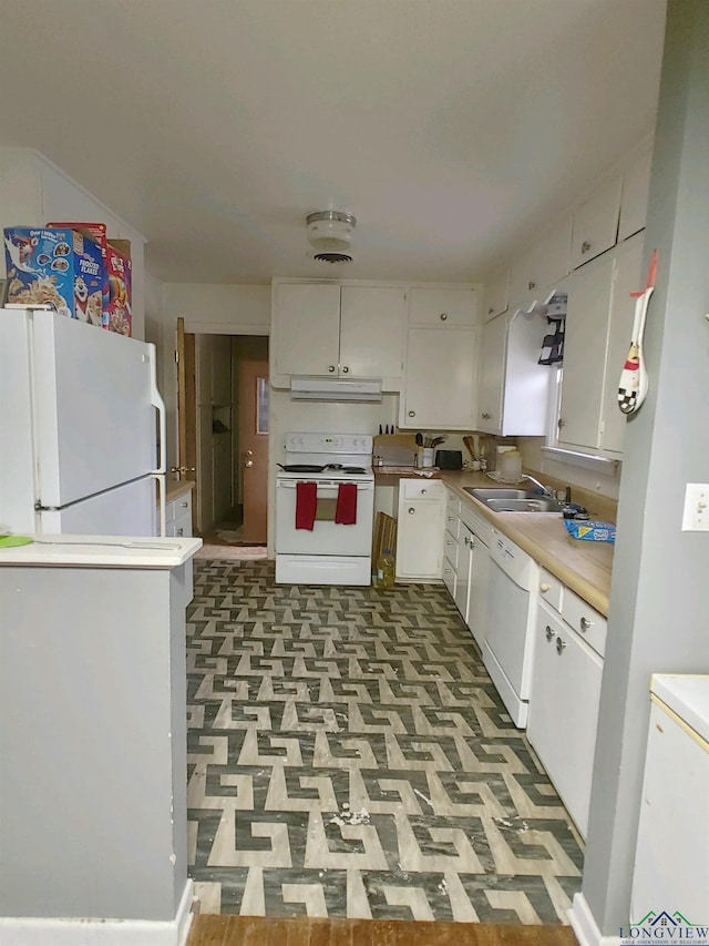 kitchen with white cabinetry, range hood, white appliances, and sink