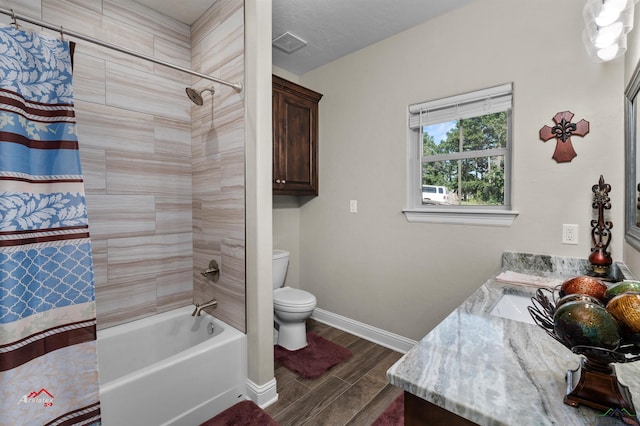 full bathroom featuring vanity, toilet, and shower / bath combo with shower curtain