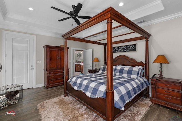 bedroom featuring a tray ceiling, ceiling fan, and ornamental molding