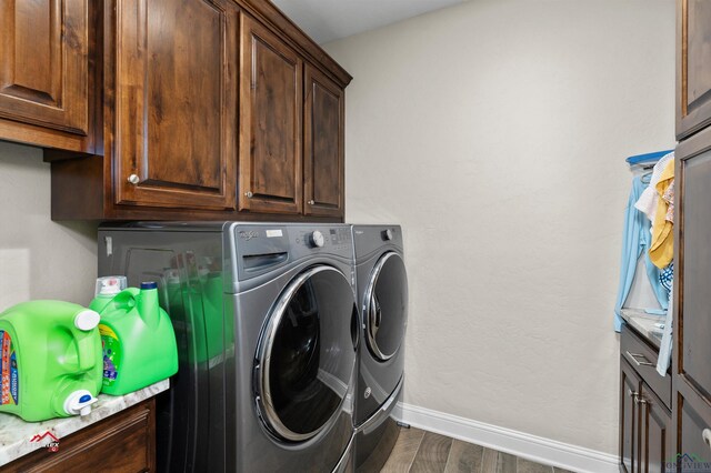 laundry area with cabinets and independent washer and dryer