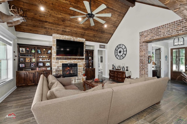 living room featuring high vaulted ceiling, french doors, a stone fireplace, ceiling fan, and beam ceiling