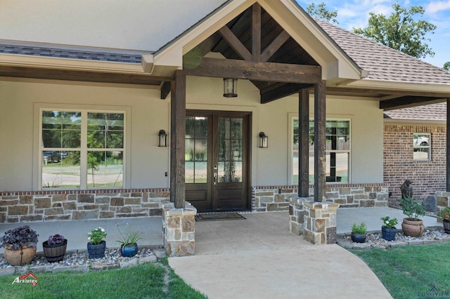 view of exterior entry featuring french doors