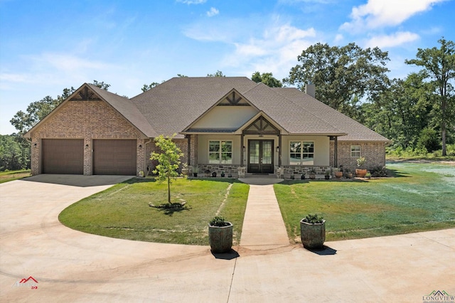 craftsman-style house featuring a front lawn, a garage, and french doors