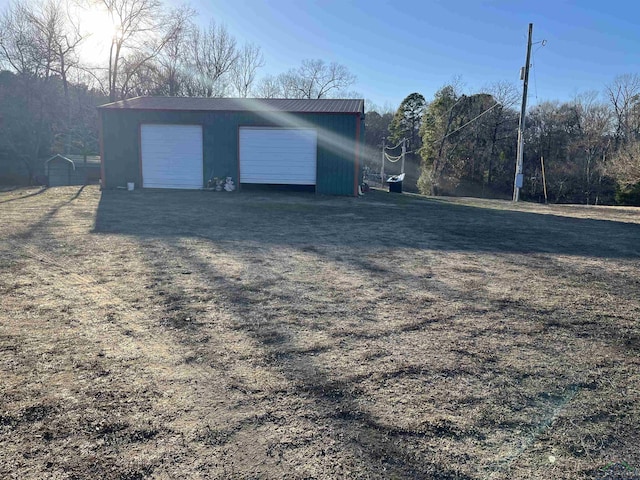 view of outbuilding with a garage