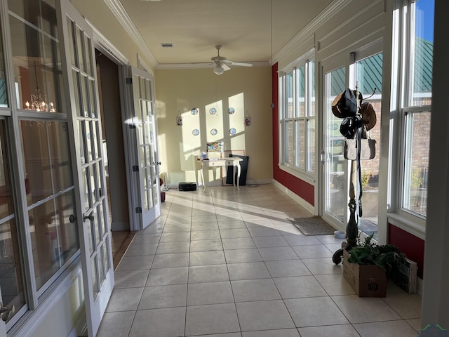 sunroom featuring french doors and ceiling fan