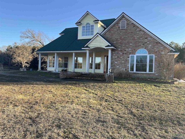 view of front of house featuring a front yard and a porch