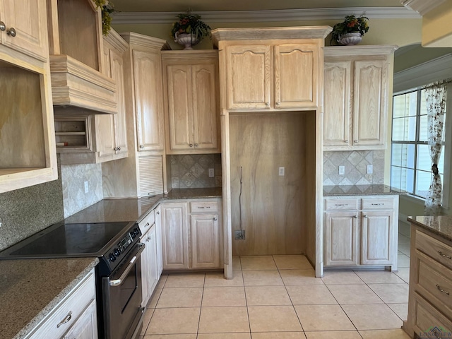 kitchen featuring ornamental molding, stainless steel electric stove, light tile patterned floors, light brown cabinets, and stone countertops