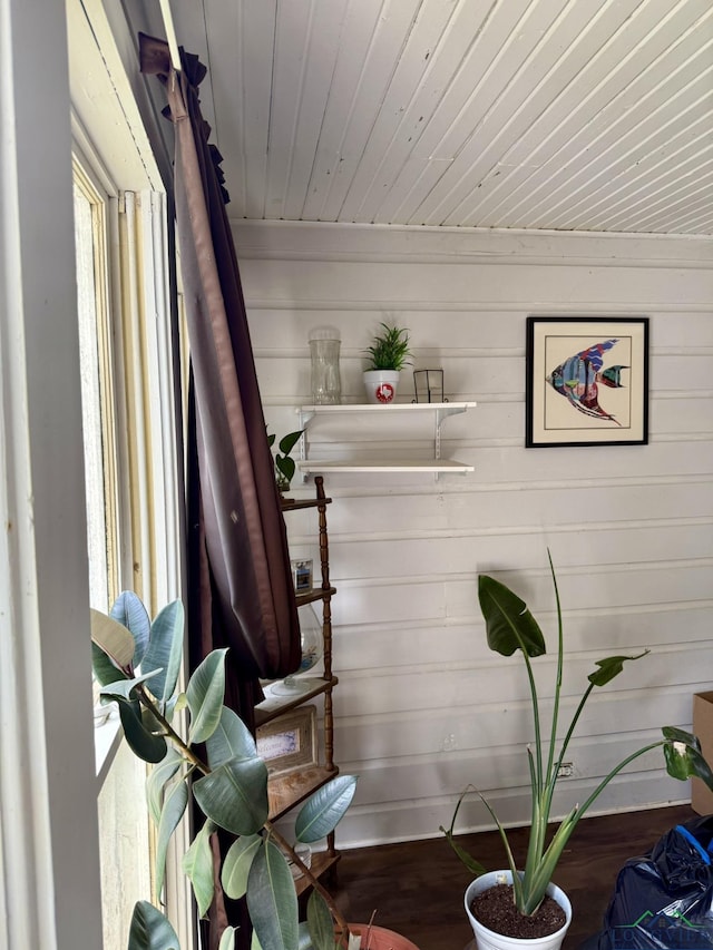 interior space with wooden ceiling and wood finished floors