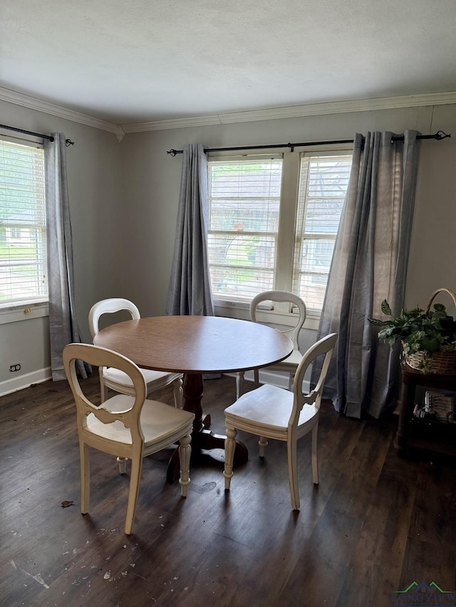 233 S Chalk St, Joaquin, TX 75954 - dining space featuring baseboards, ornamental molding, and wood finished floors