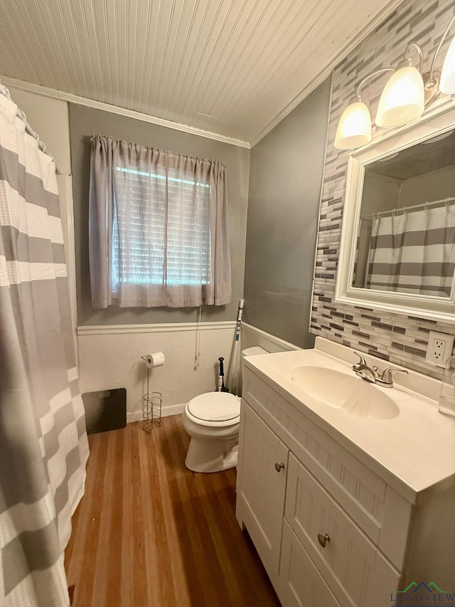 full bath with wood ceiling, wood finished floors, vanity, toilet, and ornamental molding