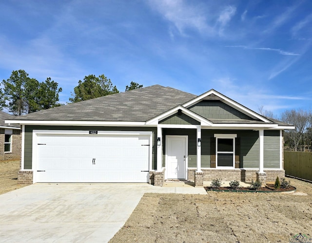 craftsman-style home featuring a garage and covered porch