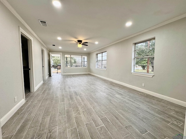 unfurnished room with ornamental molding and ceiling fan