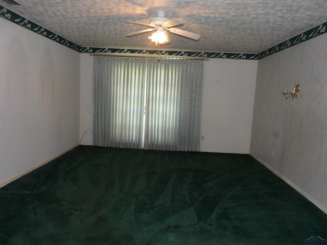 2307 Lilly St, Longview, TX 75602 - carpeted spare room with a ceiling fan and baseboards