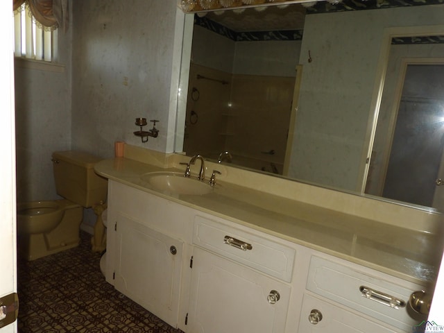 bathroom with tile patterned flooring, vanity, and toilet