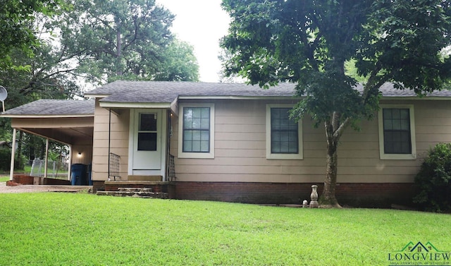 2104 Ark St, Marshall, TX 75670 - single story home featuring a front yard, a carport, and roof with shingles