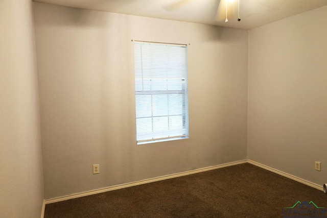 2104 Ark St, Marshall, TX 75670 - unfurnished room featuring dark carpet and ceiling fan