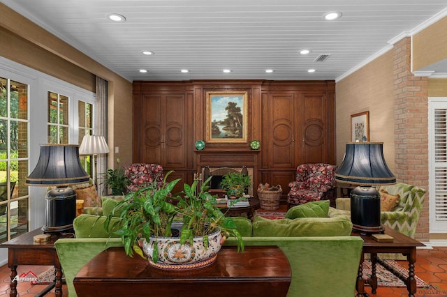 living room featuring tile patterned flooring and ornamental molding