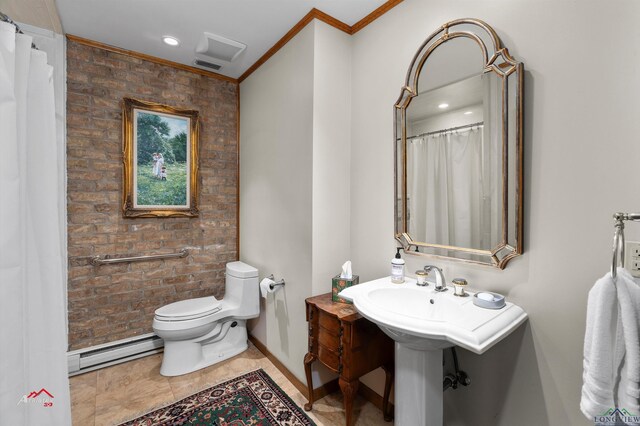 bathroom with toilet, crown molding, and a baseboard heating unit