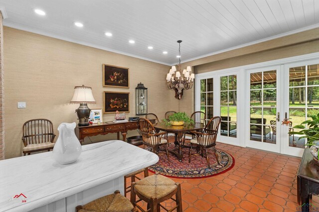 dining space featuring french doors, an inviting chandelier, crown molding, and wood ceiling