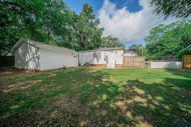 1021 N Montgomery St, Gilmer, TX 75644 - back of property featuring entry steps and an outdoor structure
