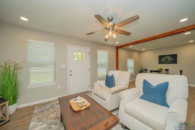 1021 N Montgomery St, Gilmer, TX 75644 - living room with wood finished floors, ceiling fan, and recessed lighting