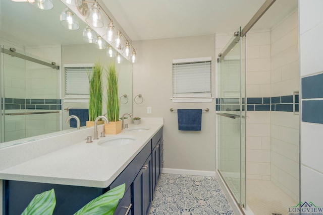 1021 N Montgomery St, Gilmer, TX 75644 - bathroom featuring double vanity, a shower stall, and tile patterned floors
