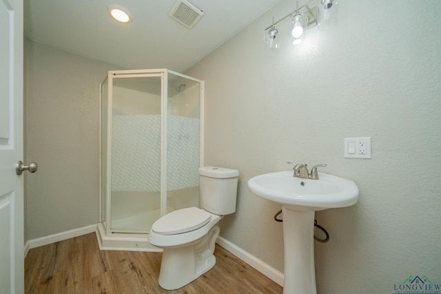 1021 N Montgomery St, Gilmer, TX 75644 - bathroom with wood finished floors and a shower stall
