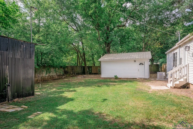 1021 N Montgomery St, Gilmer, TX 75644 - fenced backyard featuring a shed