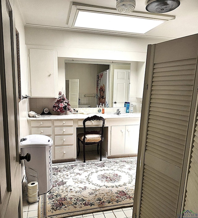 bathroom with vanity and tile patterned floors