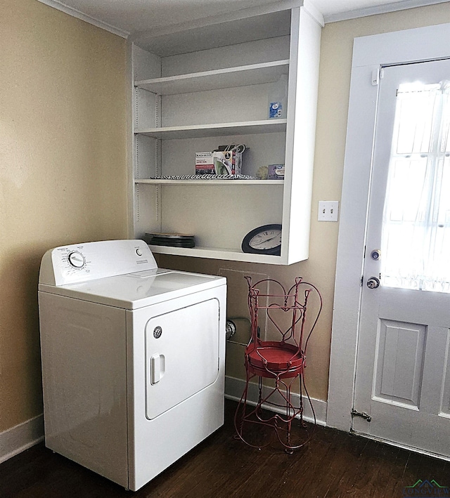 laundry room with dark wood-type flooring and washer / dryer