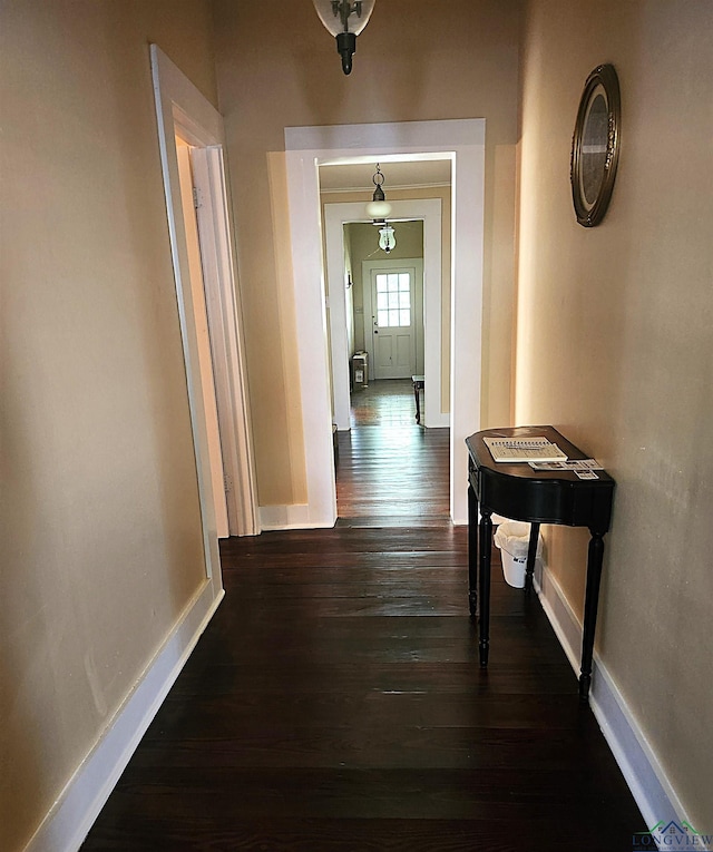 hall with dark hardwood / wood-style floors