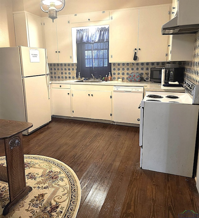 kitchen featuring white cabinetry, white appliances, sink, and dark wood-type flooring